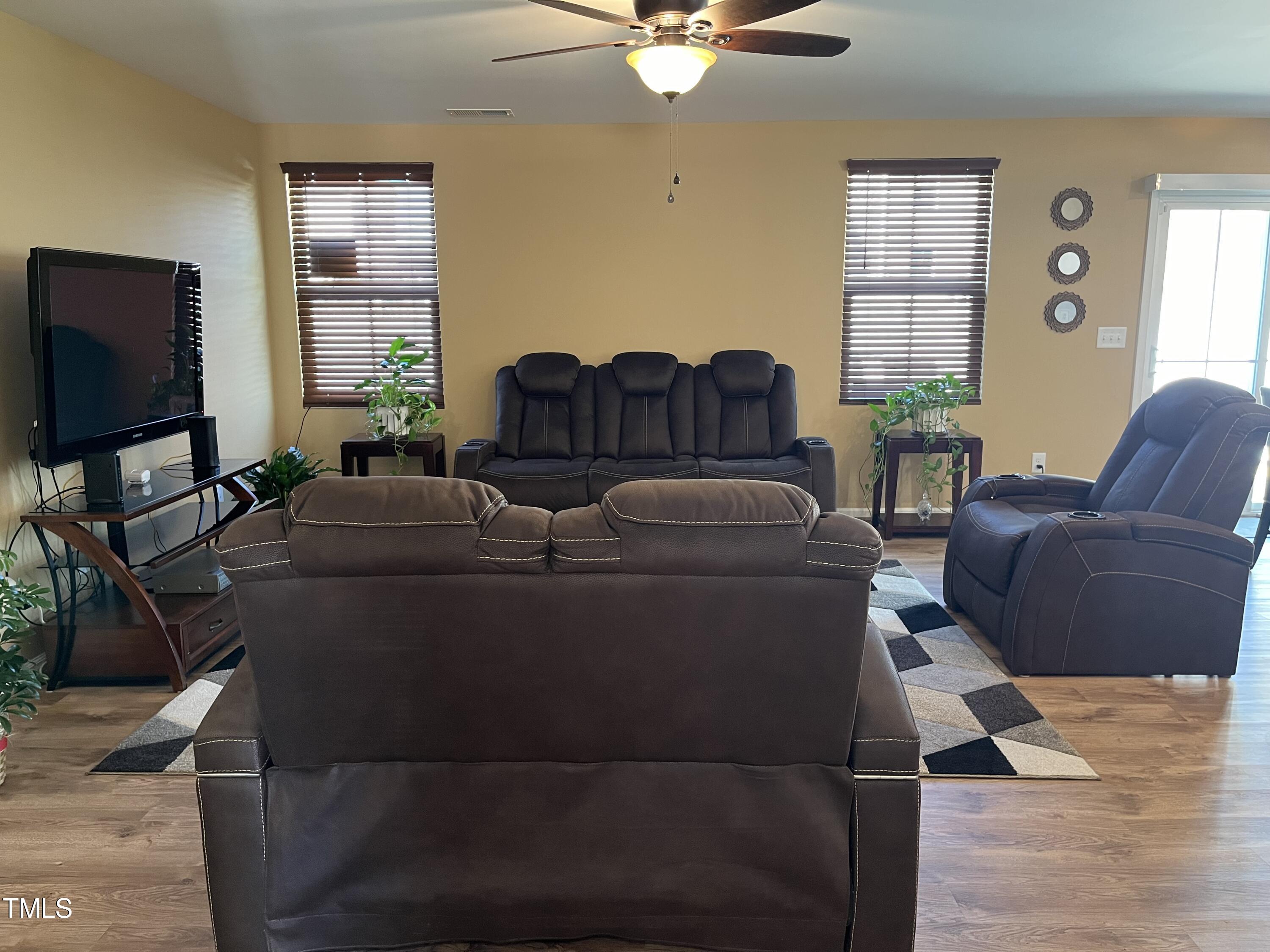 1408 Bridgewater Drive Durham, NC 27704 - Photo 23 of 41 a living room with furniture and a flat screen tv