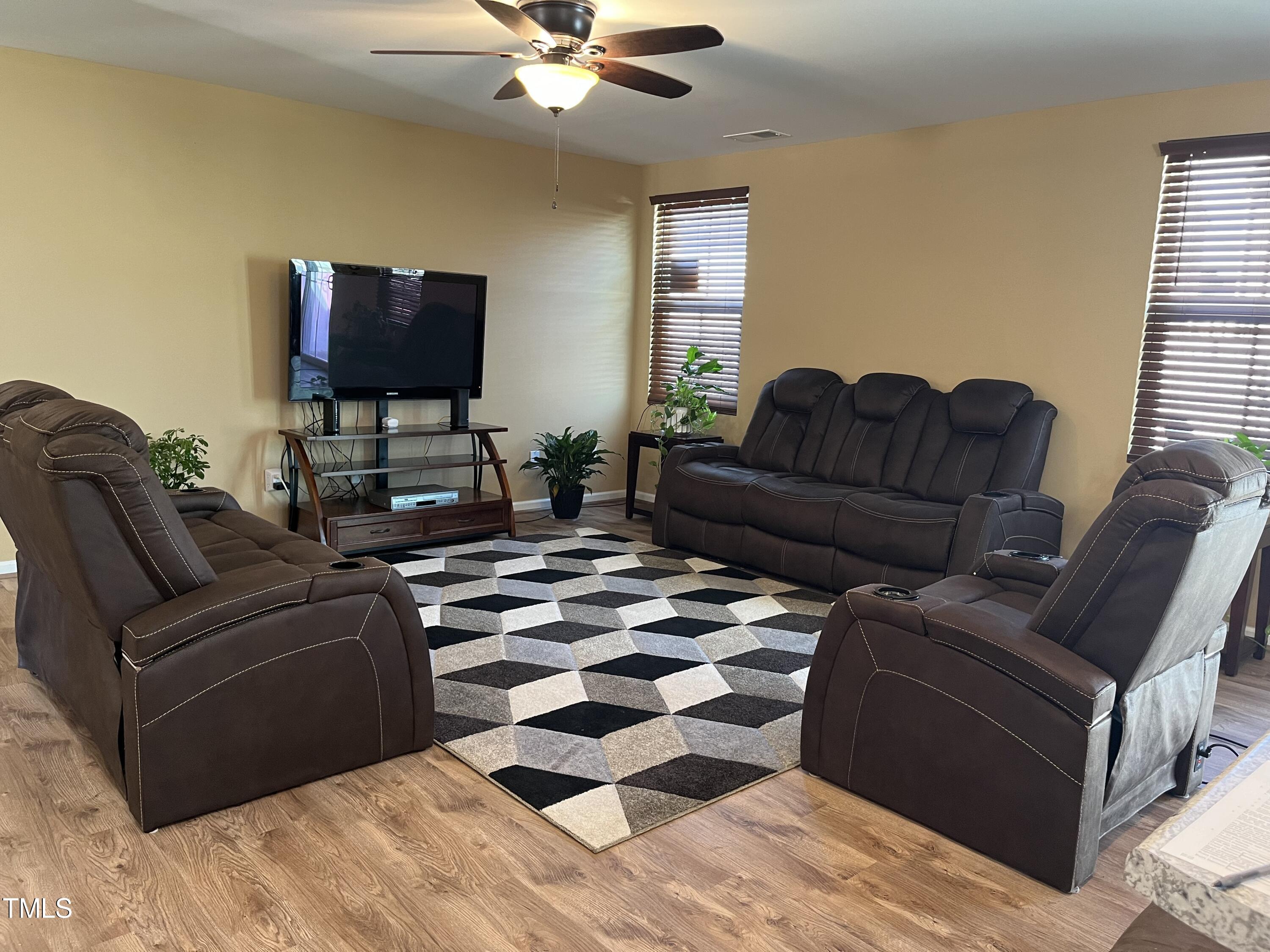 1408 Bridgewater Drive Durham, NC 27704 - Photo 24 of 41 a living room with furniture and a flat screen tv