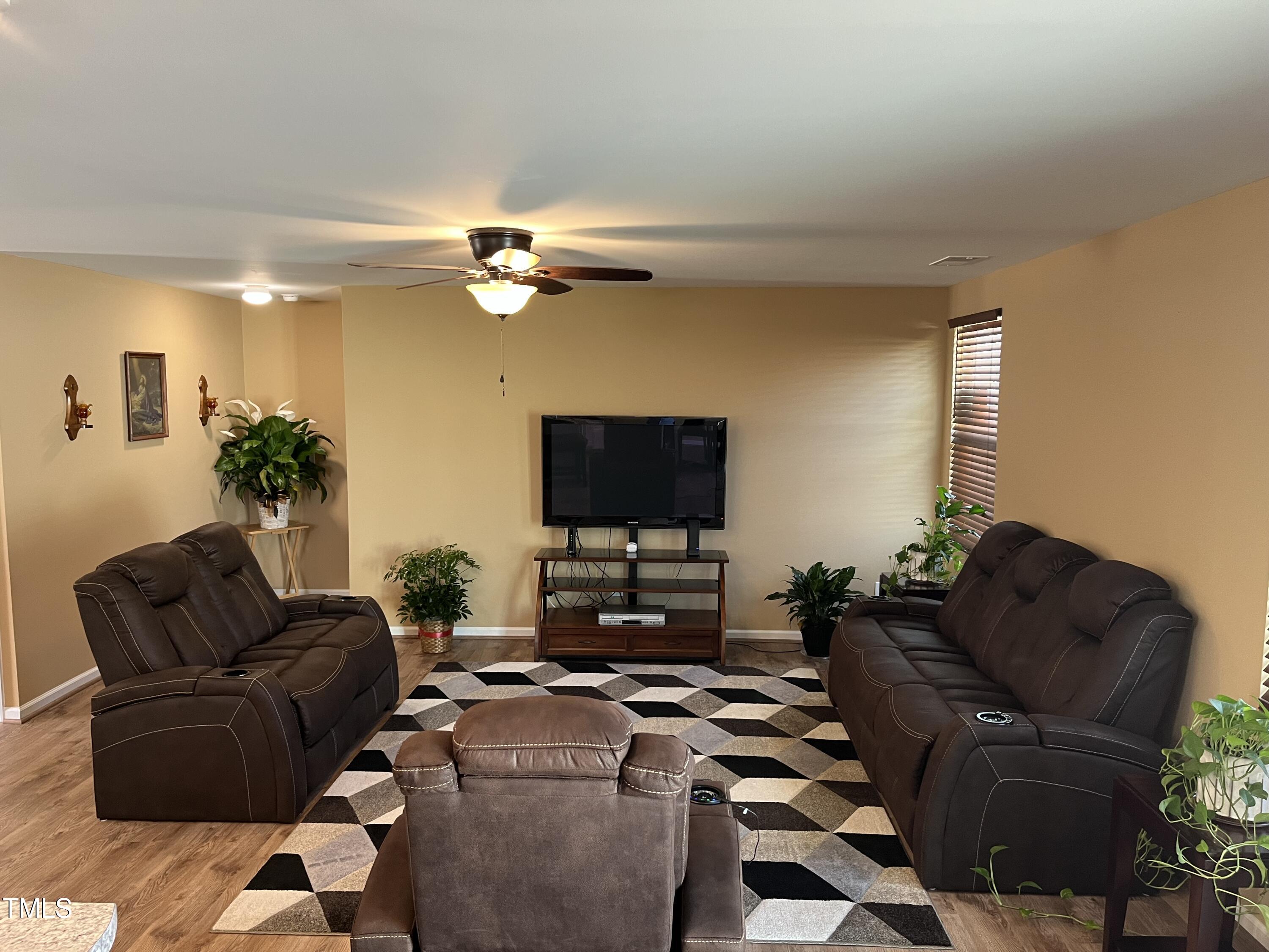 1408 Bridgewater Drive Durham, NC 27704 - Photo 26 of 41 a living room with furniture and a flat screen tv