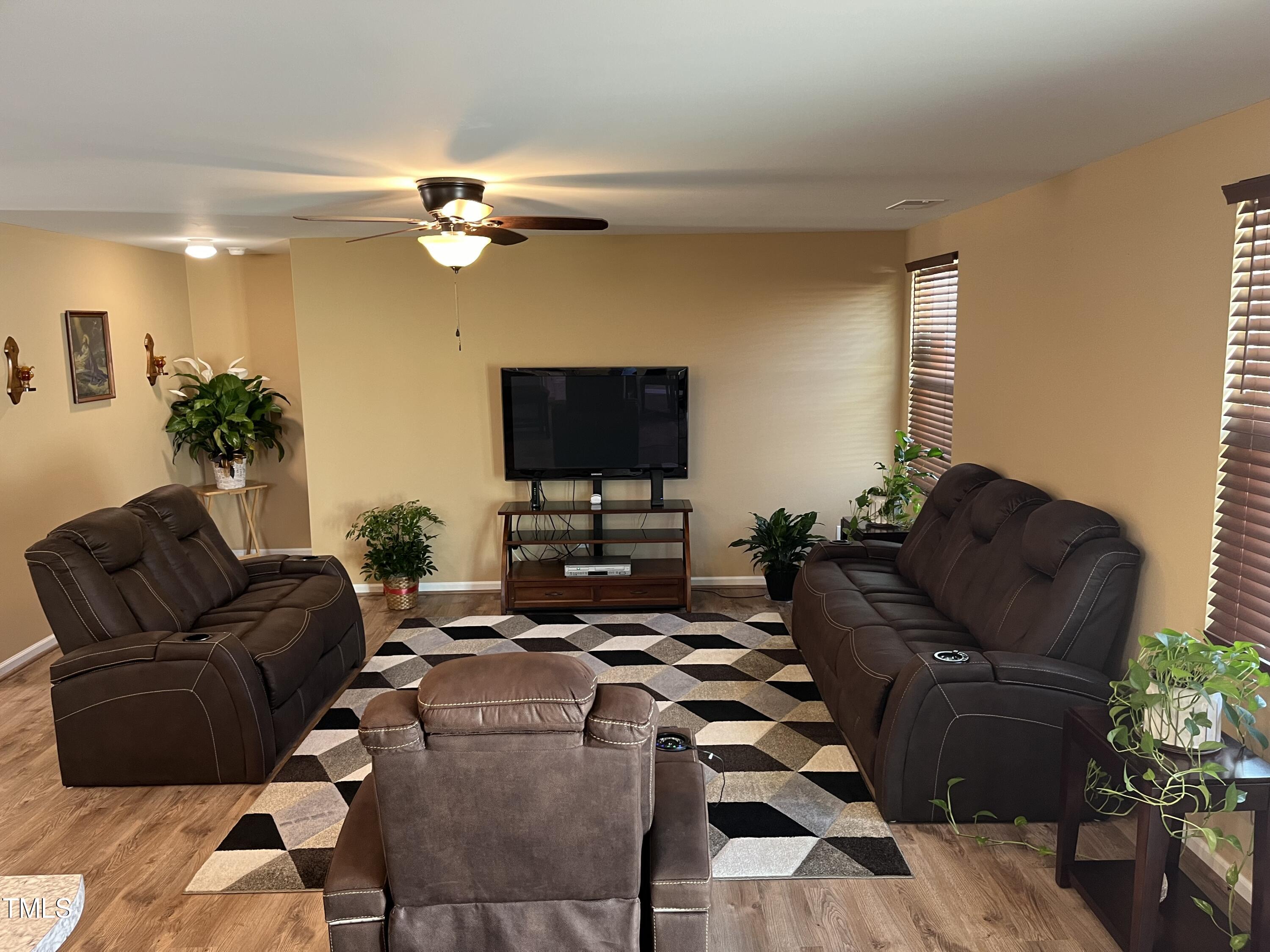 1408 Bridgewater Drive Durham, NC 27704 - Photo 27 of 41 a living room with furniture and a flat screen tv