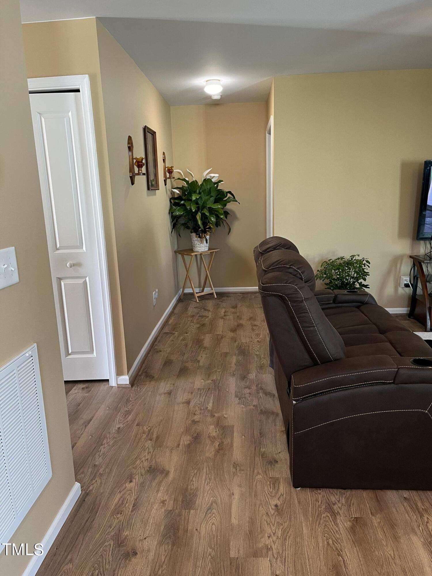 1408 Bridgewater Drive Durham, NC 27704 - Photo 28 of 41 a living room with furniture and a potted plant