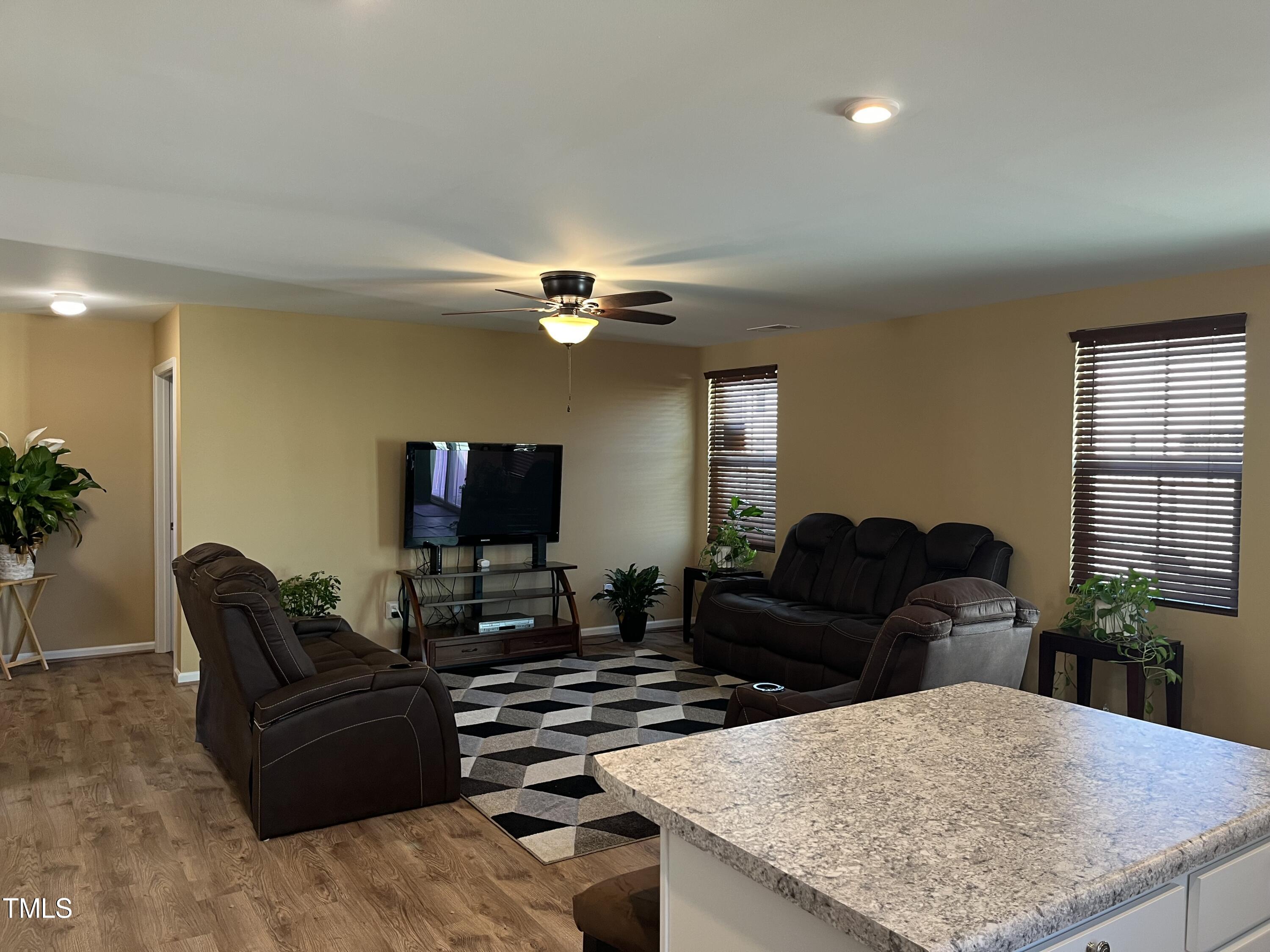 1408 Bridgewater Drive Durham, NC 27704 - Photo 29 of 41 a living room with furniture and a flat screen tv