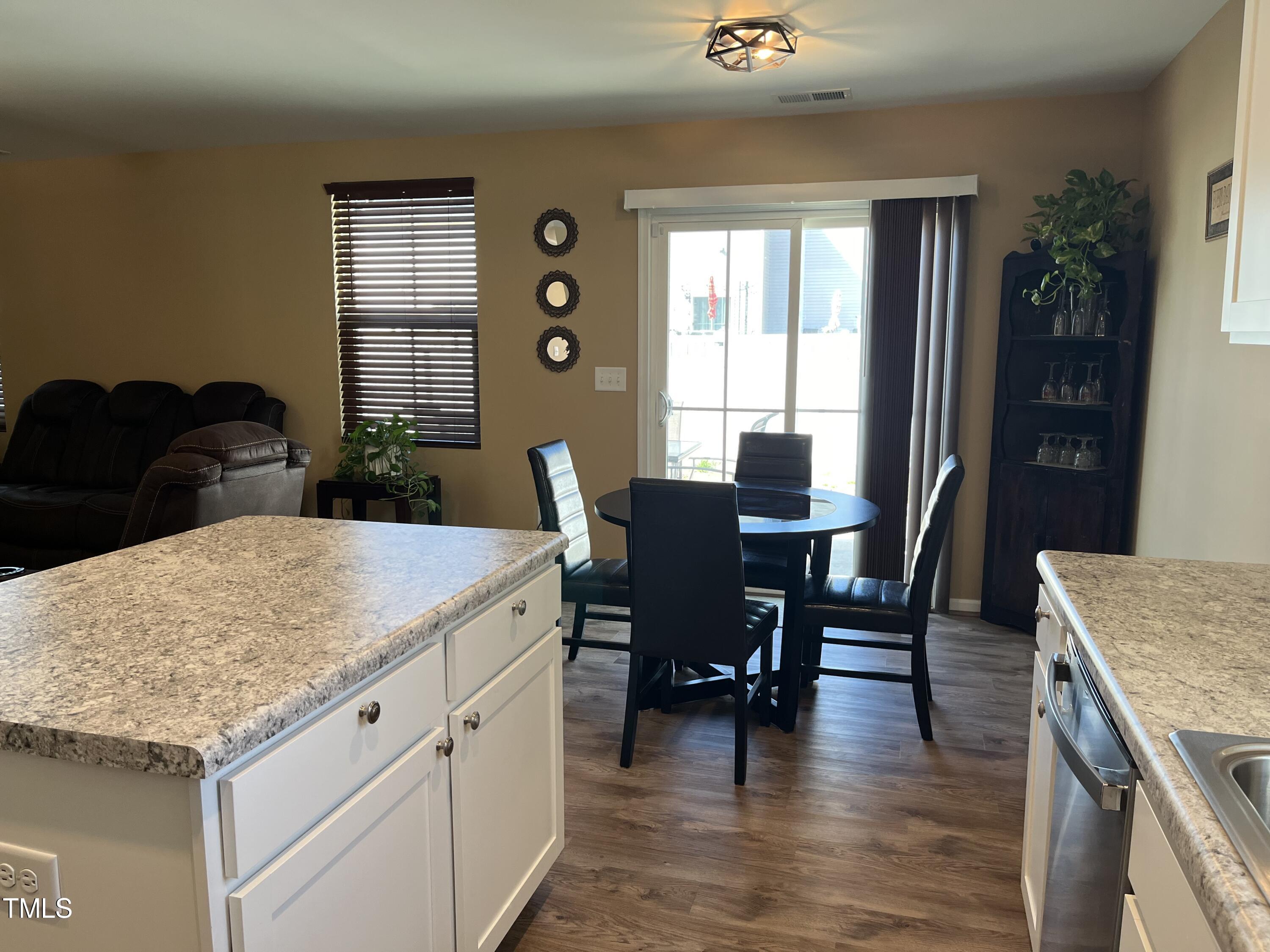 1408 Bridgewater Drive Durham, NC 27704 - Photo 34 of 41 a kitchen with a table and chairs in it
