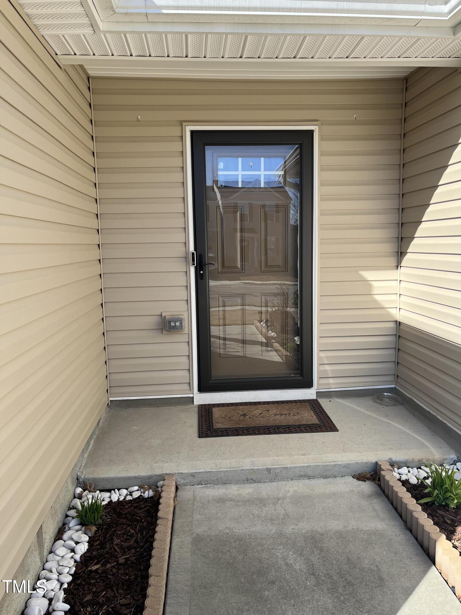 1408 Bridgewater Drive Durham, NC 27704 - Photo 5 of 41 a view of a wooden door of the house