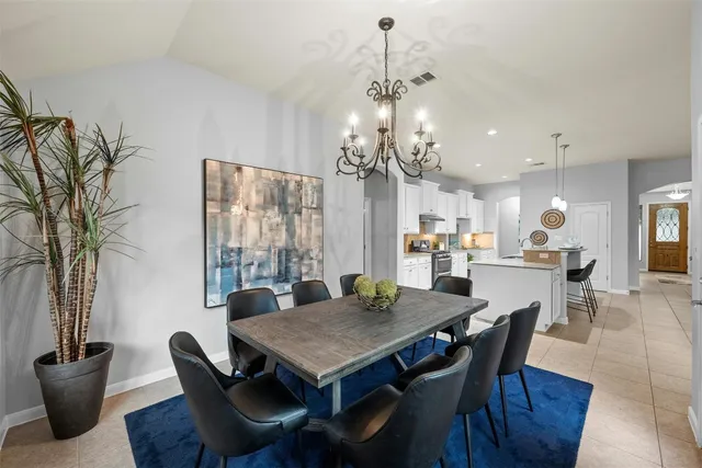 a kitchen with a sink microwave and cabinets