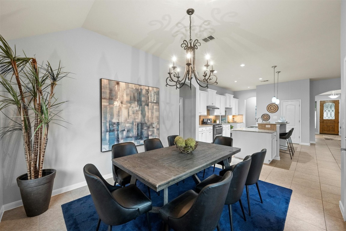 166 Briarpatch Court Austin, TX 78737 - Photo 12 of 40 a view of a dining room with furniture window and wooden floor