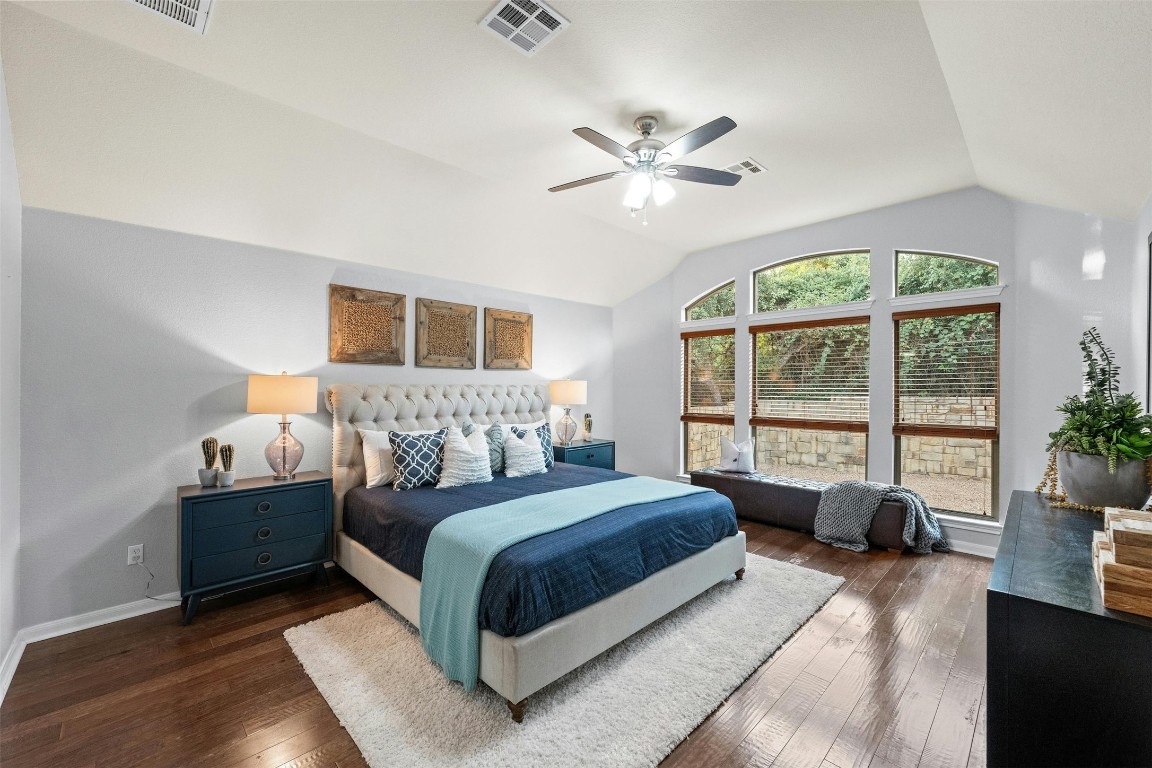 166 Briarpatch Court Austin, TX 78737 - Photo 13 of 40 a spacious bedroom with a large bed and a large window