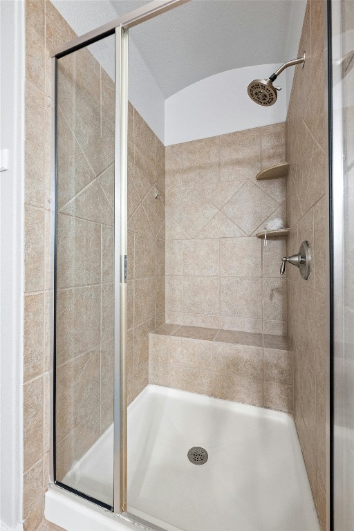 166 Briarpatch Court Austin, TX 78737 - Photo 17 of 40 a bathroom with a glass shower door