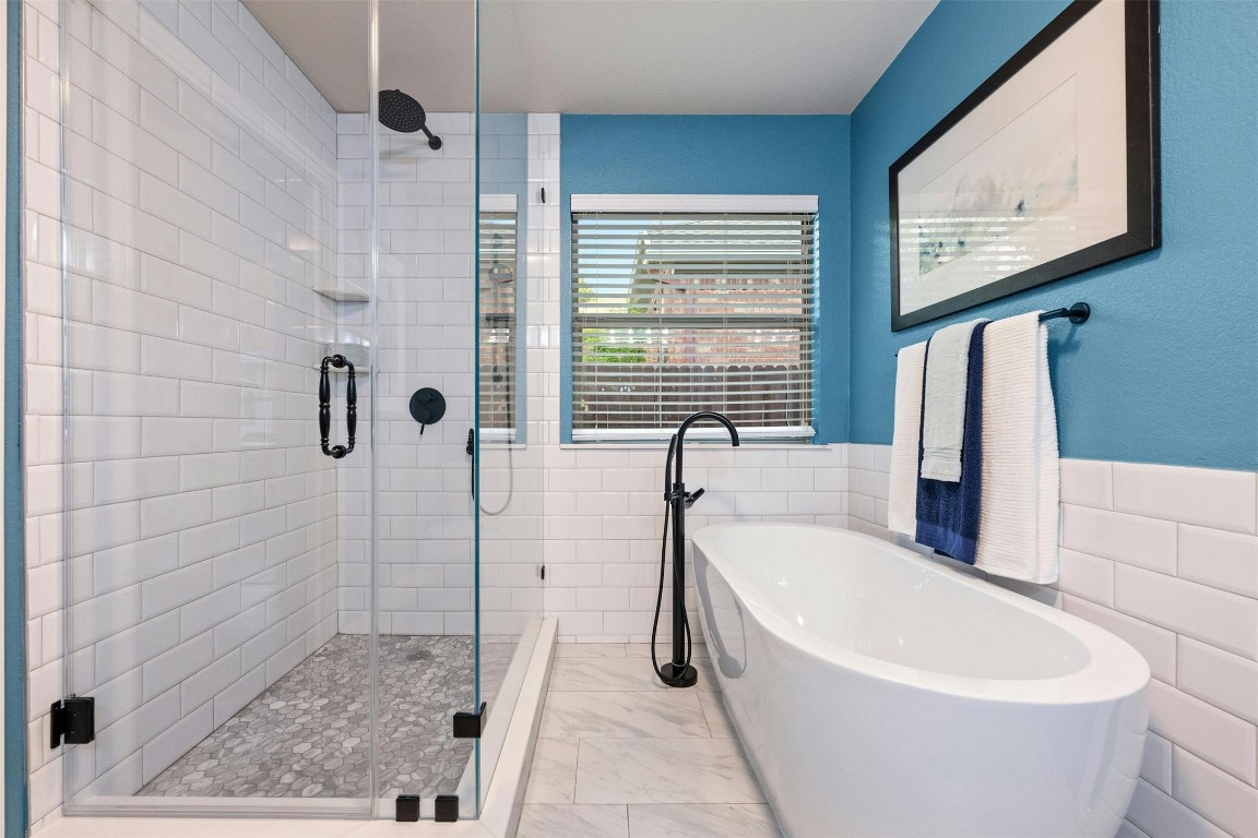 166 Briarpatch Court Austin, TX 78737 - Photo 21 of 40 a white bath tub sitting next to a shower