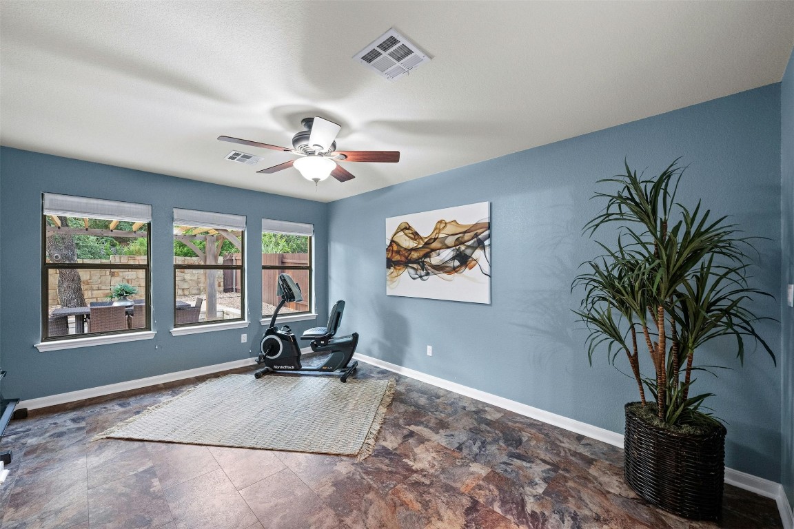 166 Briarpatch Court Austin, TX 78737 - Photo 22 of 40 a living room with furniture potted plant and a window