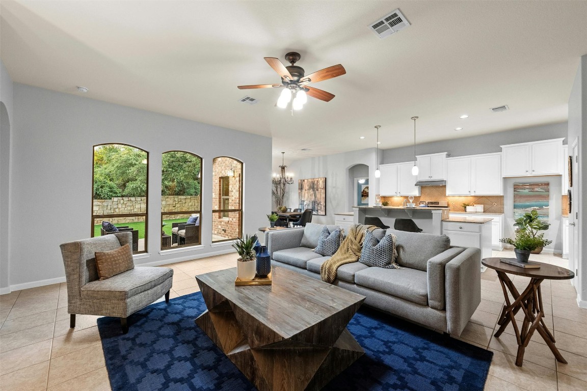 166 Briarpatch Court Austin, TX 78737 - Photo 8 of 40 a living room with furniture kitchen view and a large window