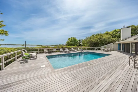 a view of a swimming pool with a lounge chairs