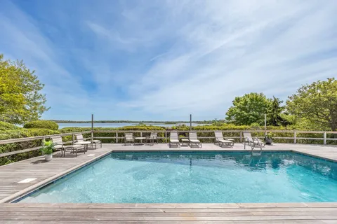 a view of a park with large trees