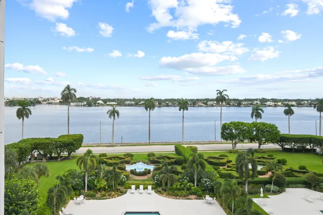 a view of a garden with a building in the background
