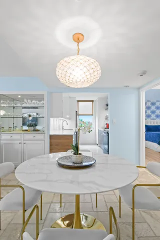 a dining room with a table and chairs