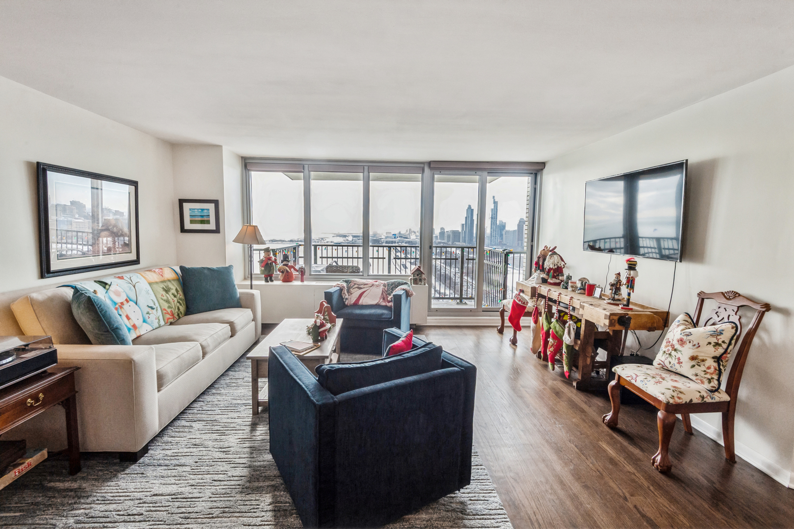 400 East Randolph Street, Unit 3209 Chicago, IL 60601 - Photo 23 of 59 a living room with furniture and a floor to ceiling window