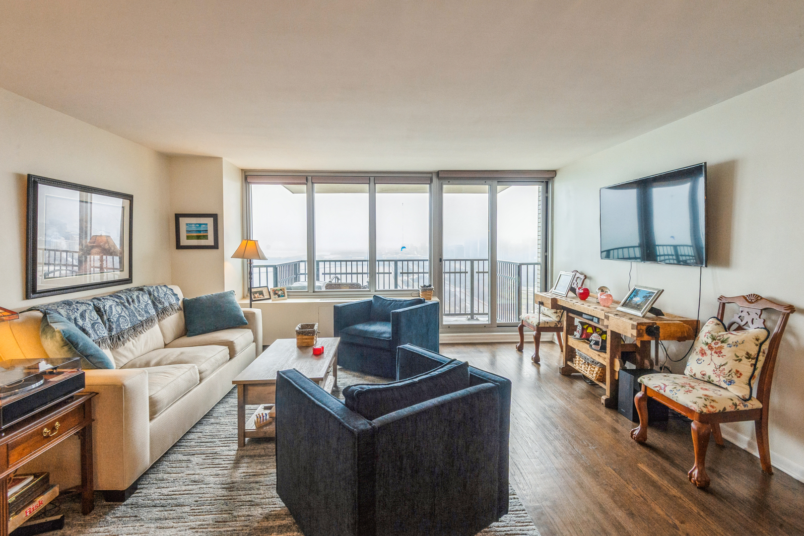 400 East Randolph Street, Unit 3209 Chicago, IL 60601 - Photo 28 of 59 a living room with furniture and a floor to ceiling window