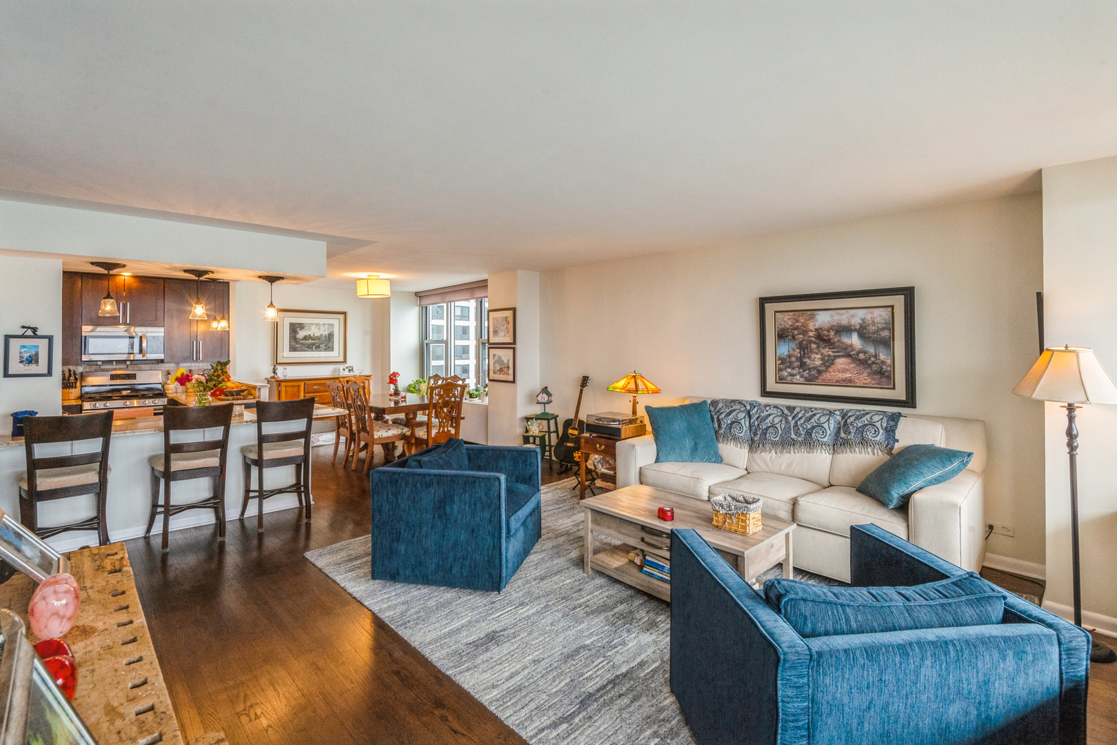 400 East Randolph Street, Unit 3209 Chicago, IL 60601 - Photo 5 of 59 a living room with furniture and a view of kitchen