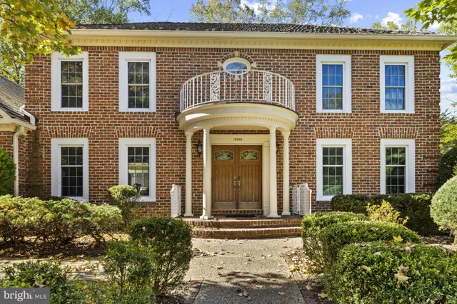 front view of a brick house with a outdoor shower