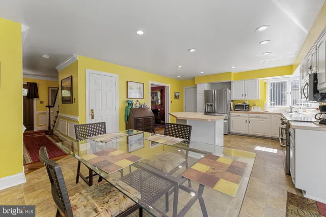 a kitchen with stainless steel appliances a refrigerator and a stove