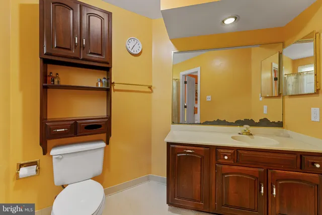 a bathroom with a shower toilet and sink