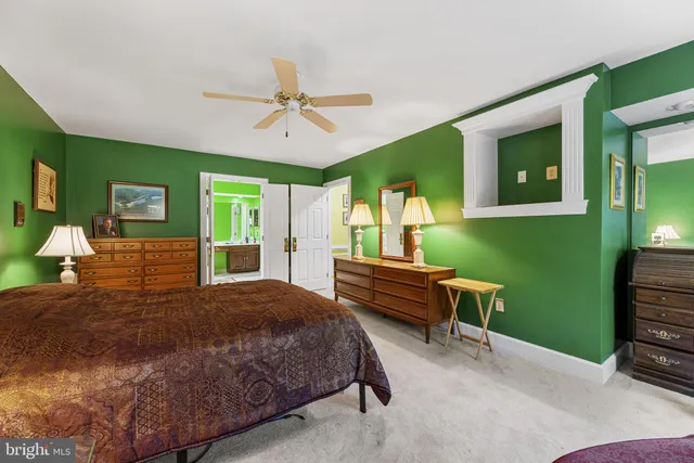 a bathroom with a sink a large mirror and a shower