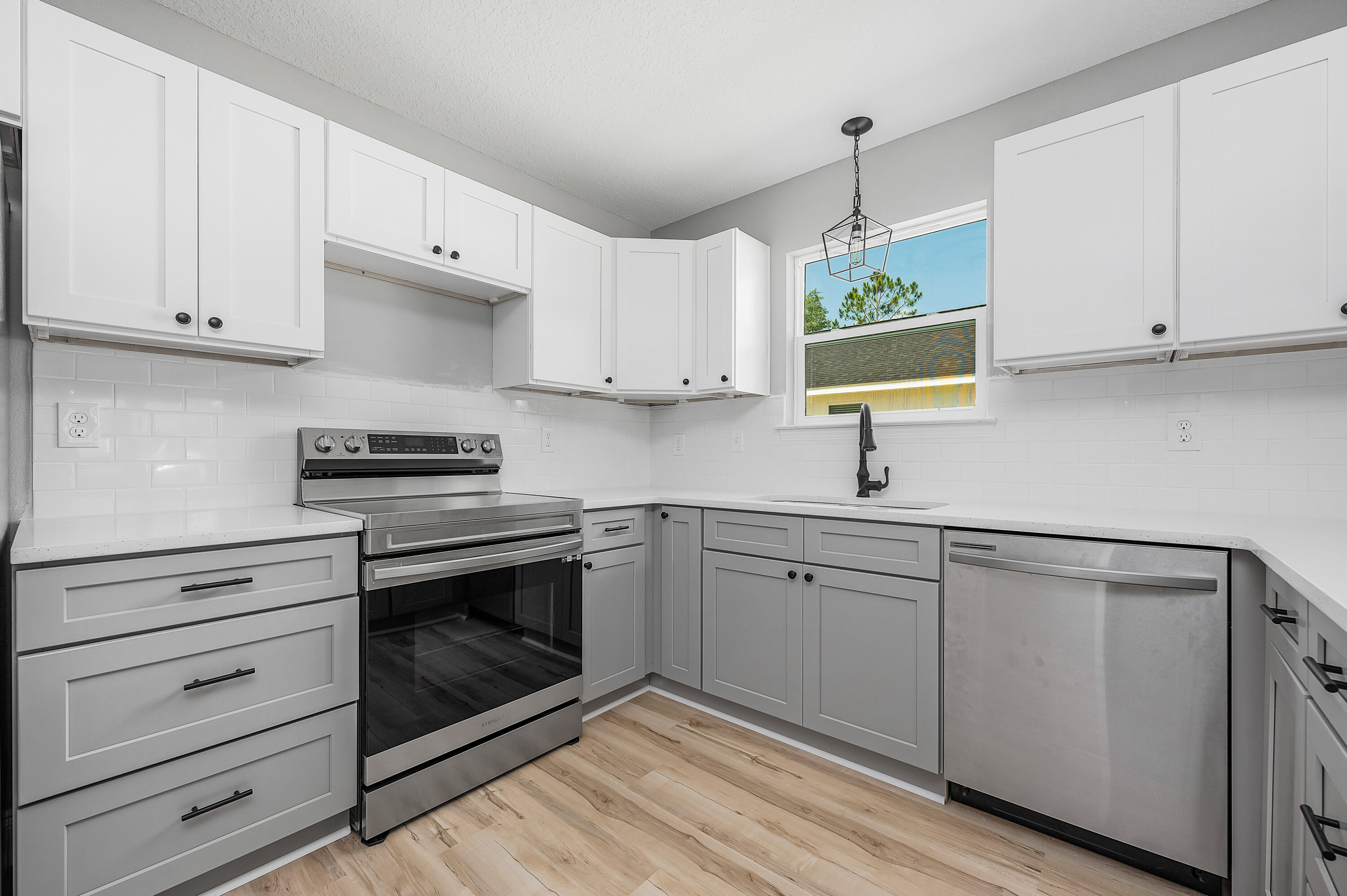 4622 Dove Way Crestview, FL 32539 - Photo 12 of 39 a kitchen with appliances cabinets and a sink