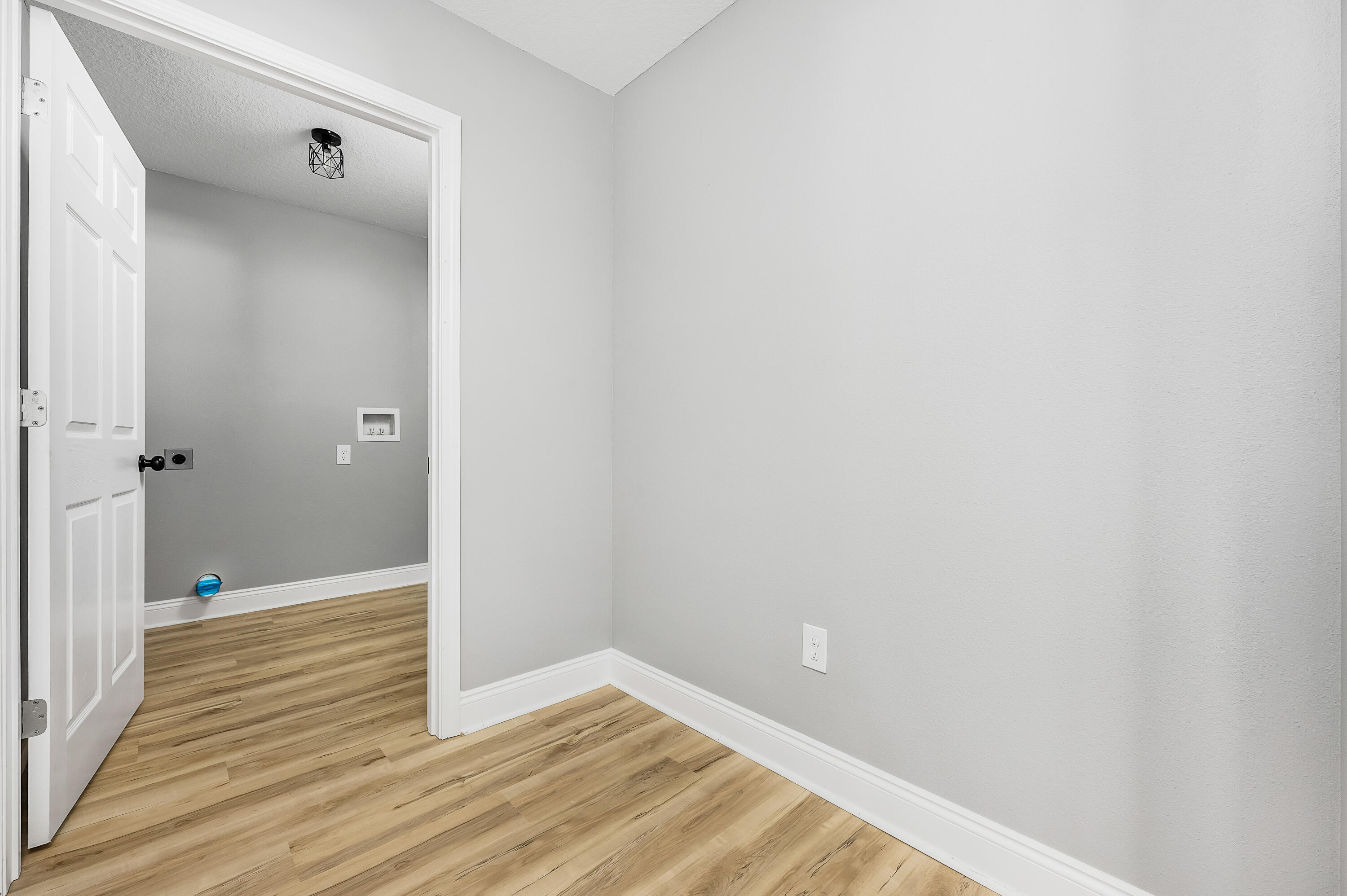 4622 Dove Way Crestview, FL 32539 - Photo 16 of 39 a view of a hallway with wooden floor
