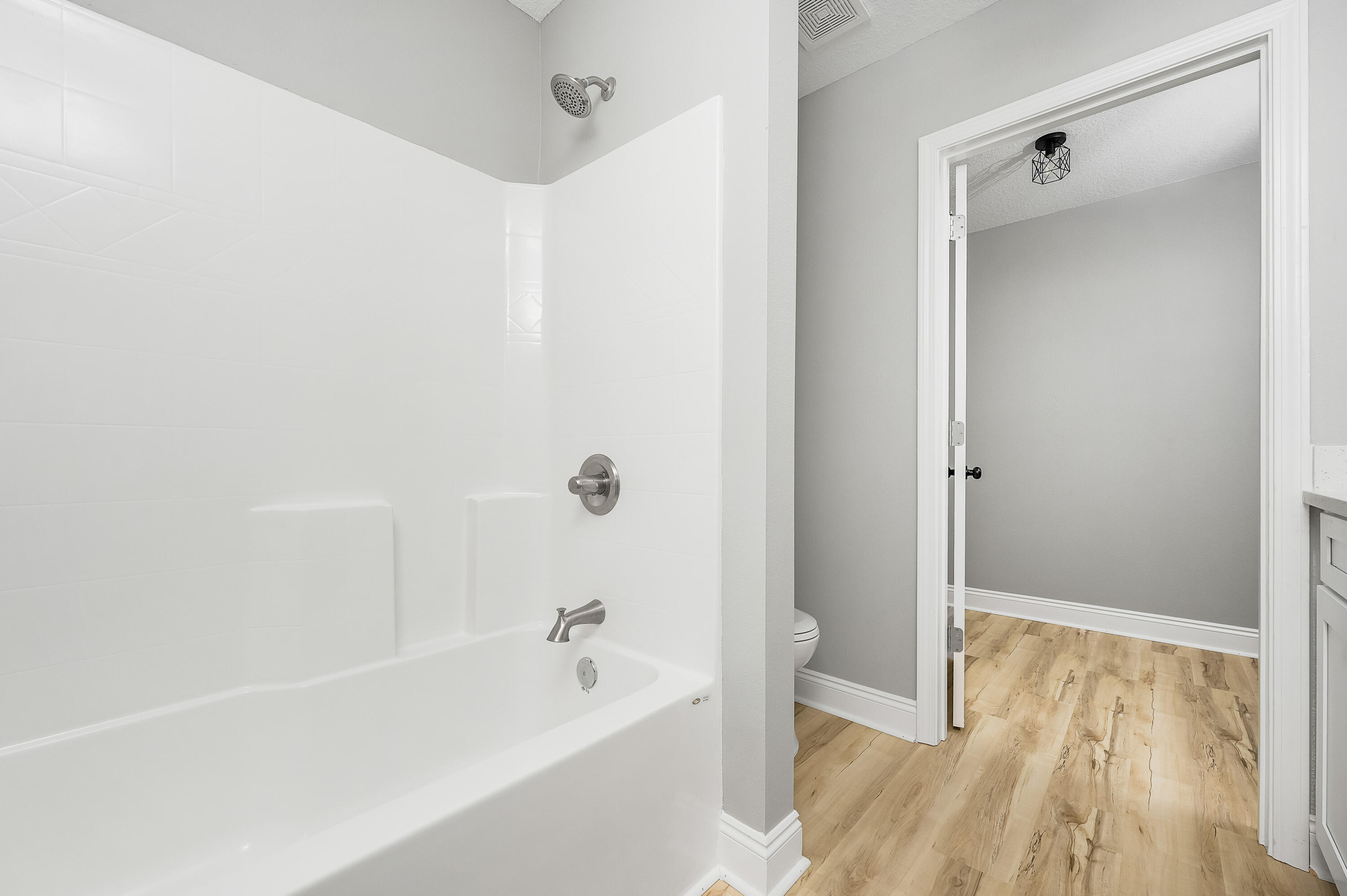 4622 Dove Way Crestview, FL 32539 - Photo 28 of 39 a bathroom with a bathtub and a shower