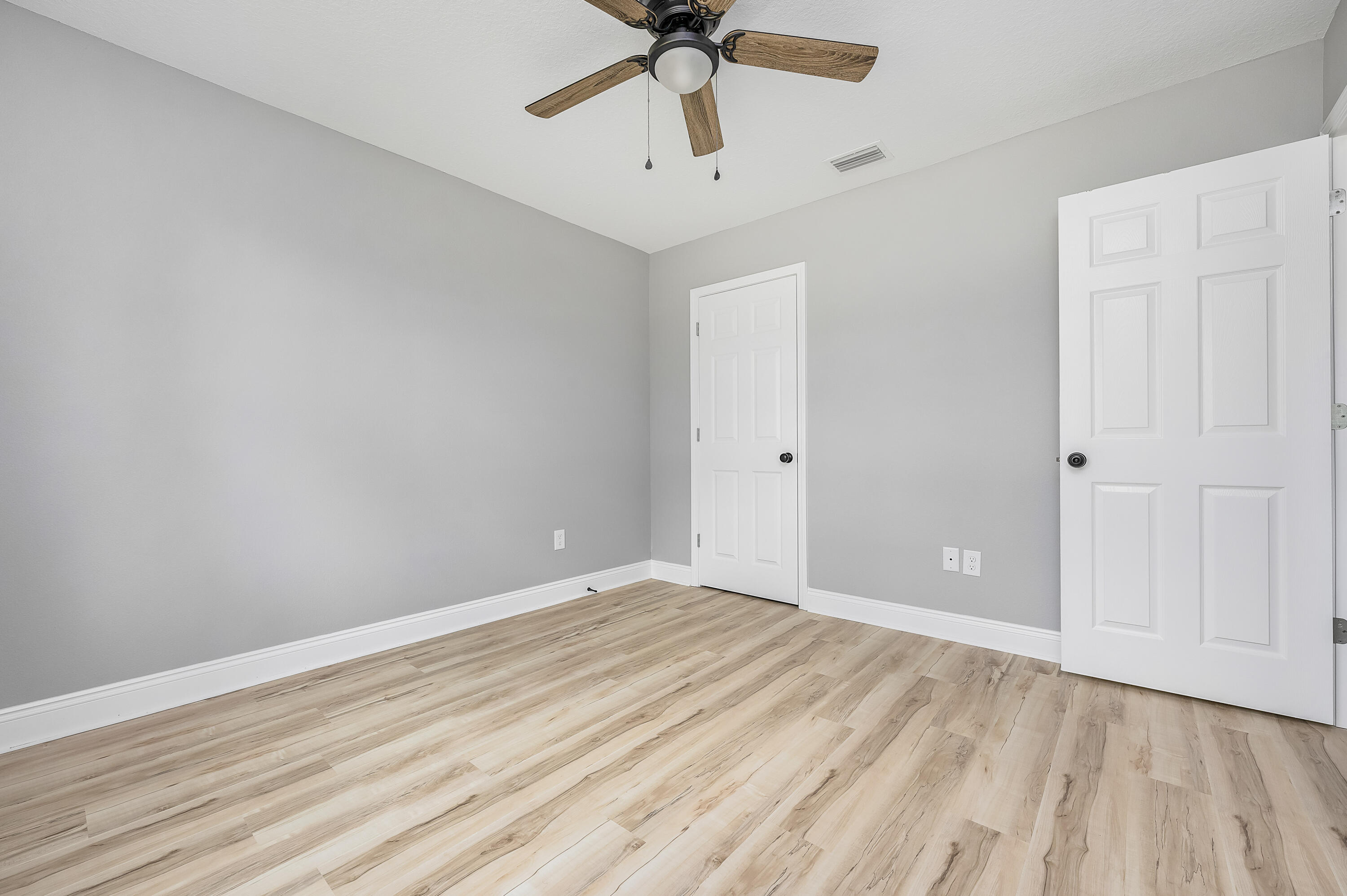4622 Dove Way Crestview, FL 32539 - Photo 33 of 39 wooden floor in an empty room
