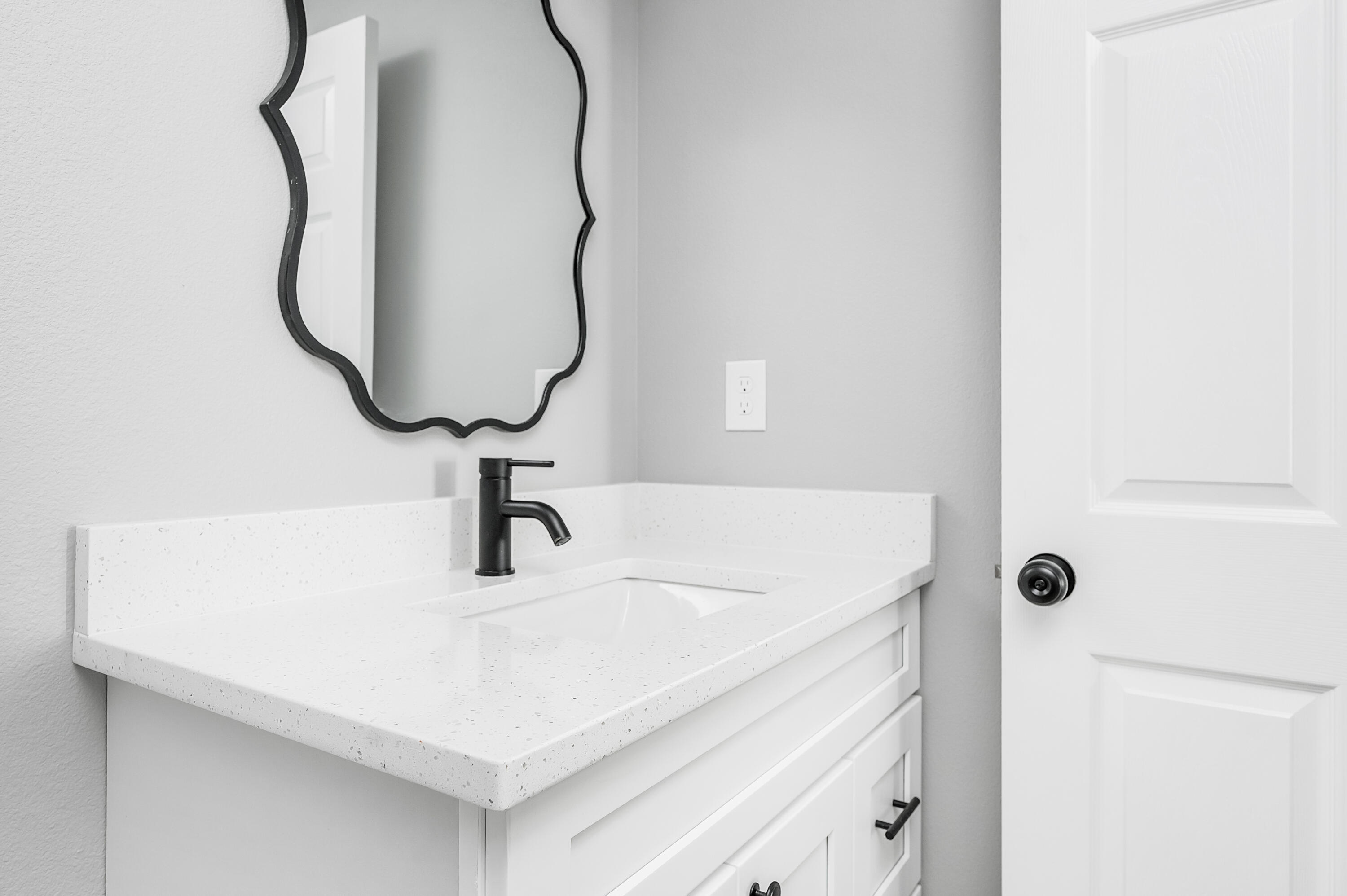 4622 Dove Way Crestview, FL 32539 - Photo 36 of 39 a bathroom with a sink and a mirror