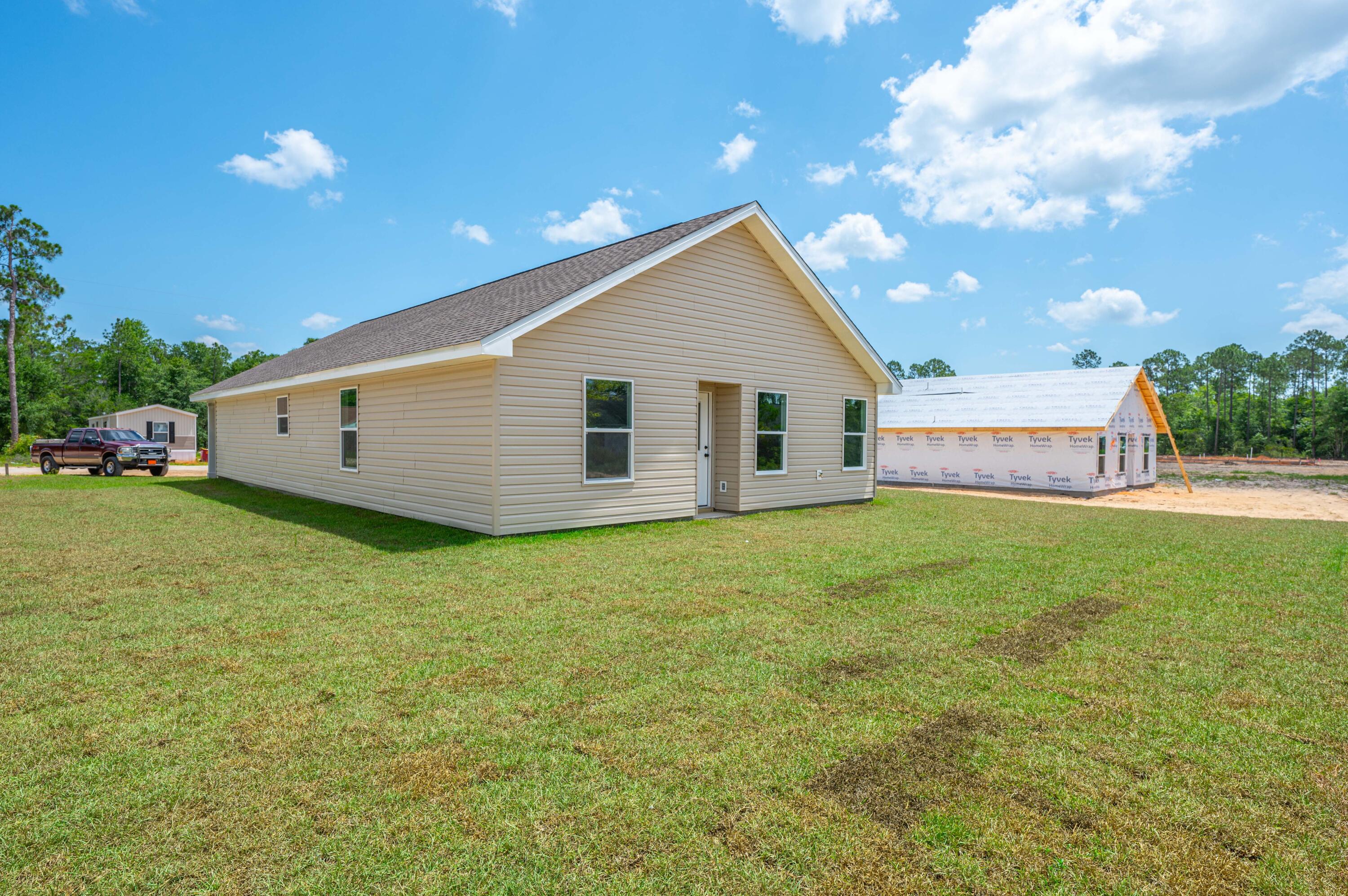 4622 Dove Way Crestview, FL 32539 - Photo 39 of 39 a view of a house with a backyard