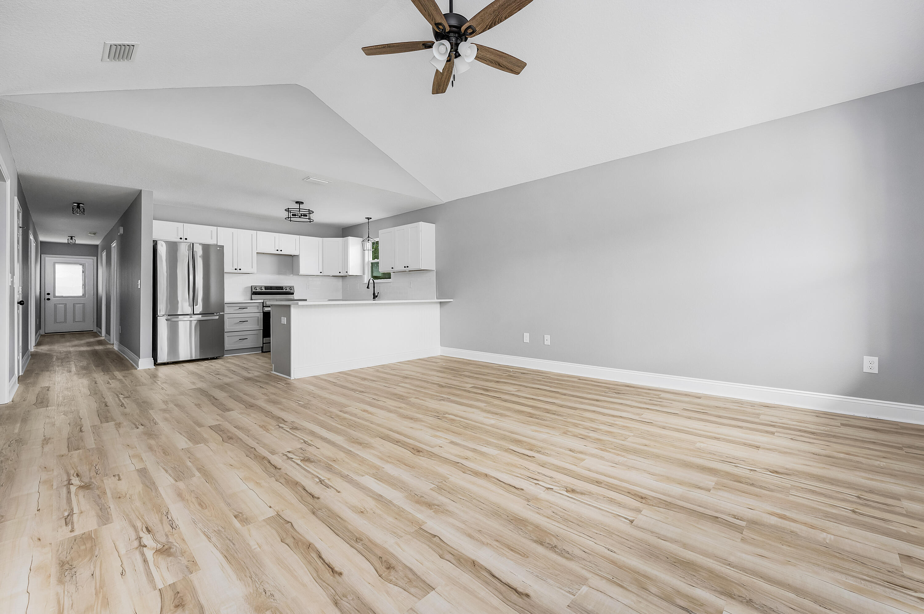 4622 Dove Way Crestview, FL 32539 - Photo 4 of 39 a view of a kitchen with a sink and a stove top oven