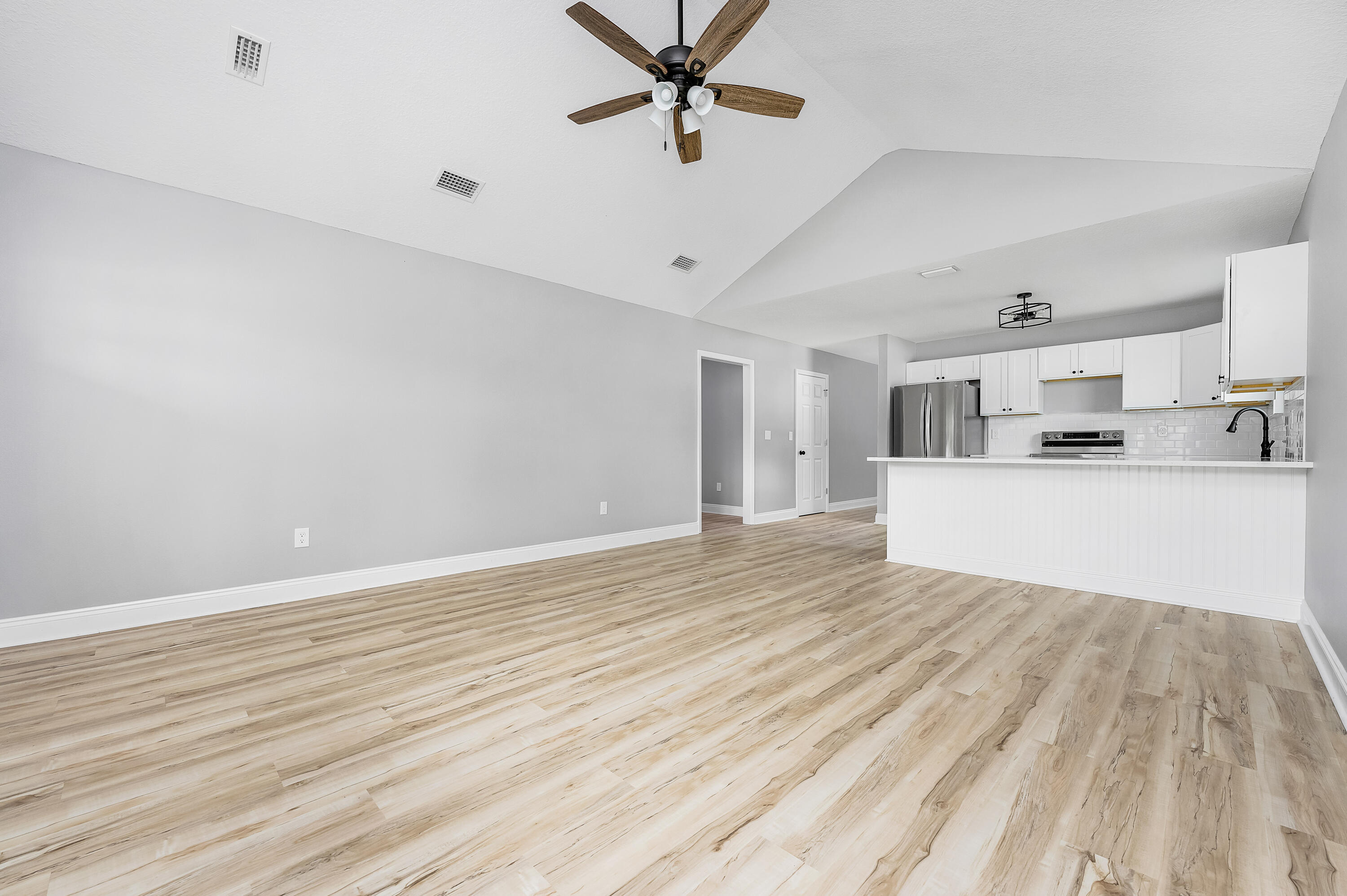 4622 Dove Way Crestview, FL 32539 - Photo 5 of 39 a view of a kitchen with a sink and cabinets