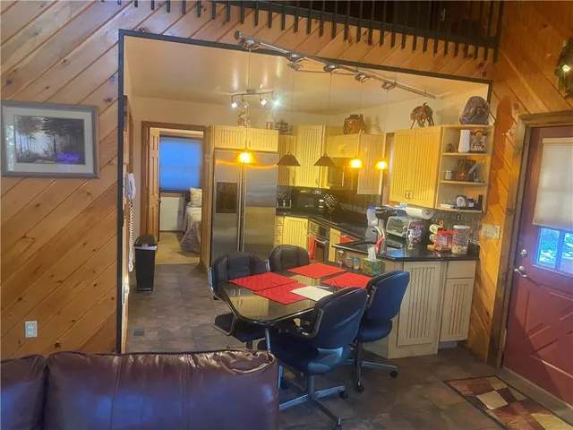 a bed sitting in a room next to a window