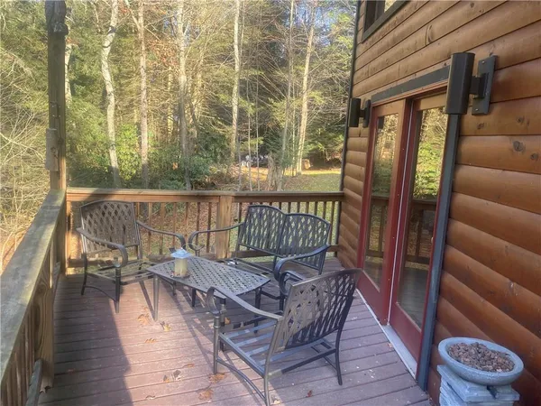 a view of a balcony with furniture