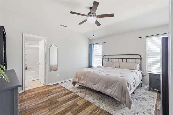 a bedroom with bed and a window