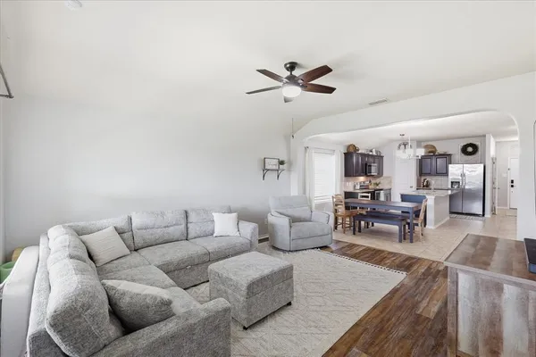 a living room with furniture and a table