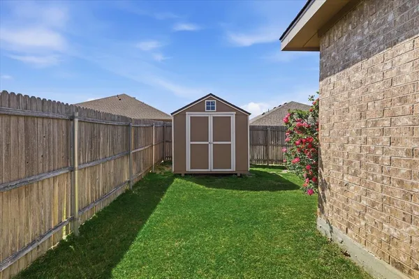 a front view of a house with yard