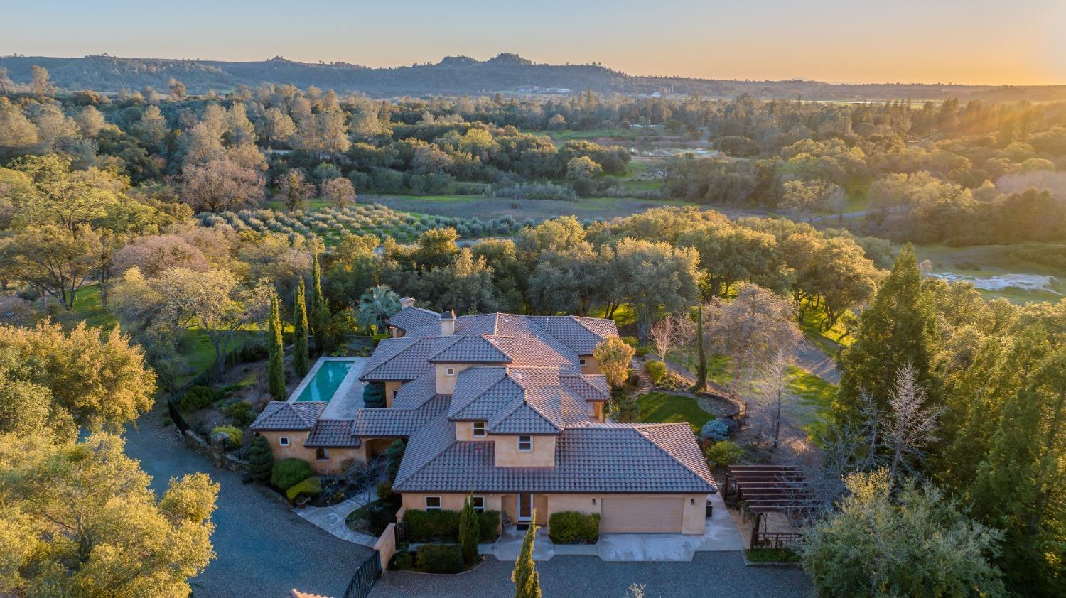 5682 Red Valley Road Ione, CA 95640 - Photo 1 of 1 an aerial view of house with yard and lake view