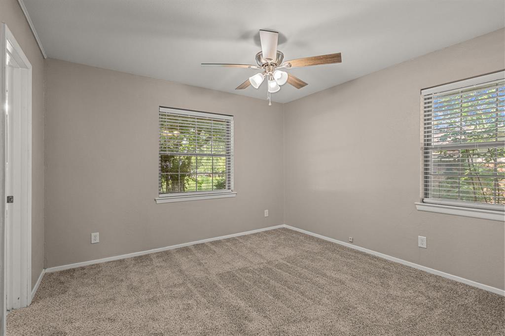 2216 Archer Trail Denton, TX 76209 - Photo 16 of 26 an empty room with windows and fan