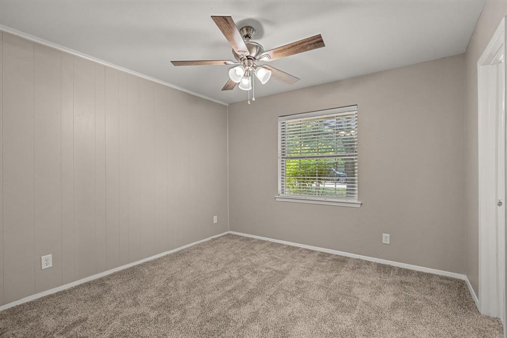 2216 Archer Trail Denton, TX 76209 - Photo 18 of 26 an empty room with a window and a fan
