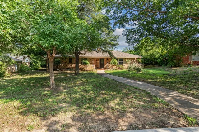 a view of a house with a yard porch and sitting area
