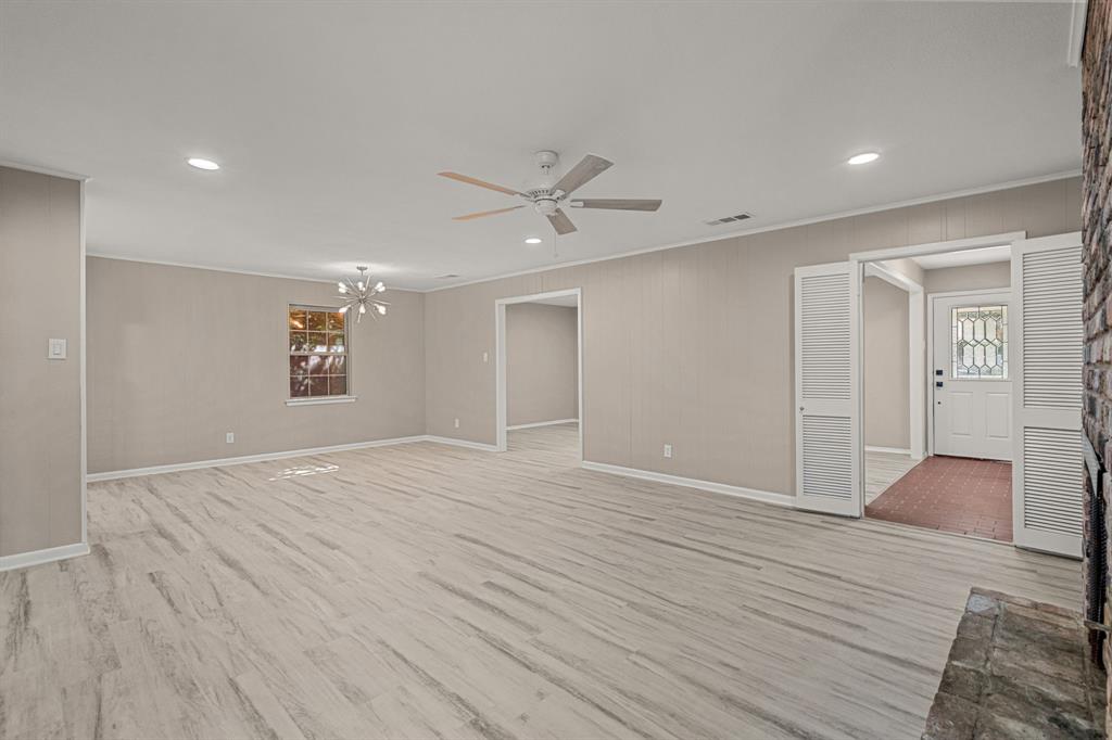 2216 Archer Trail Denton, TX 76209 - Photo 9 of 26 wooden floor in an empty room with a window