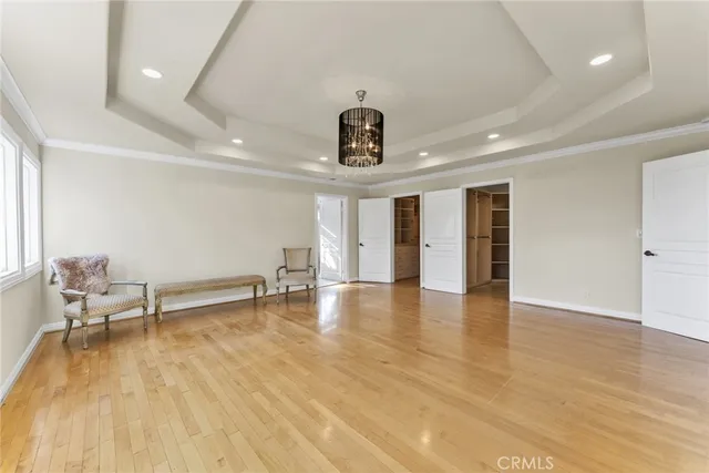 a spacious bathroom with a granite countertop sink a toilet a mirror and shower