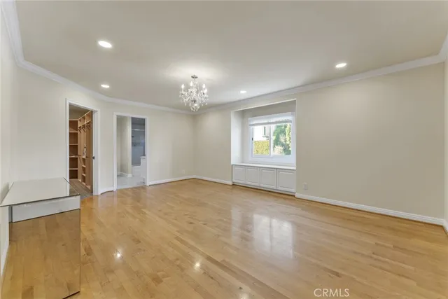 a bathroom with a granite countertop sink a toilet a mirror and shower