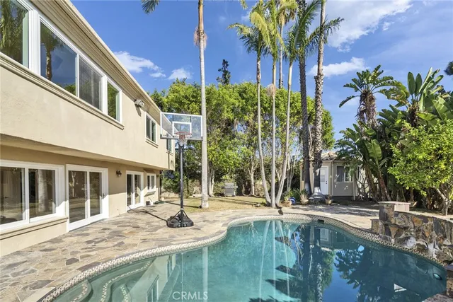 a view of a swimming pool with a patio