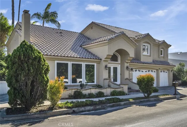 front view of a house with a garden