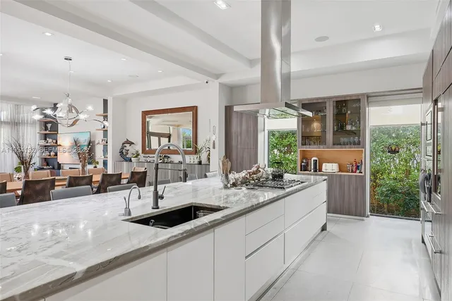a living room with furniture and large windows