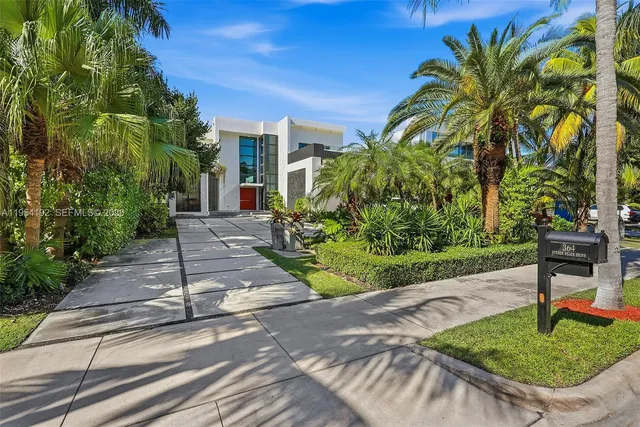 a view of a patio with table and chairs and potted plants